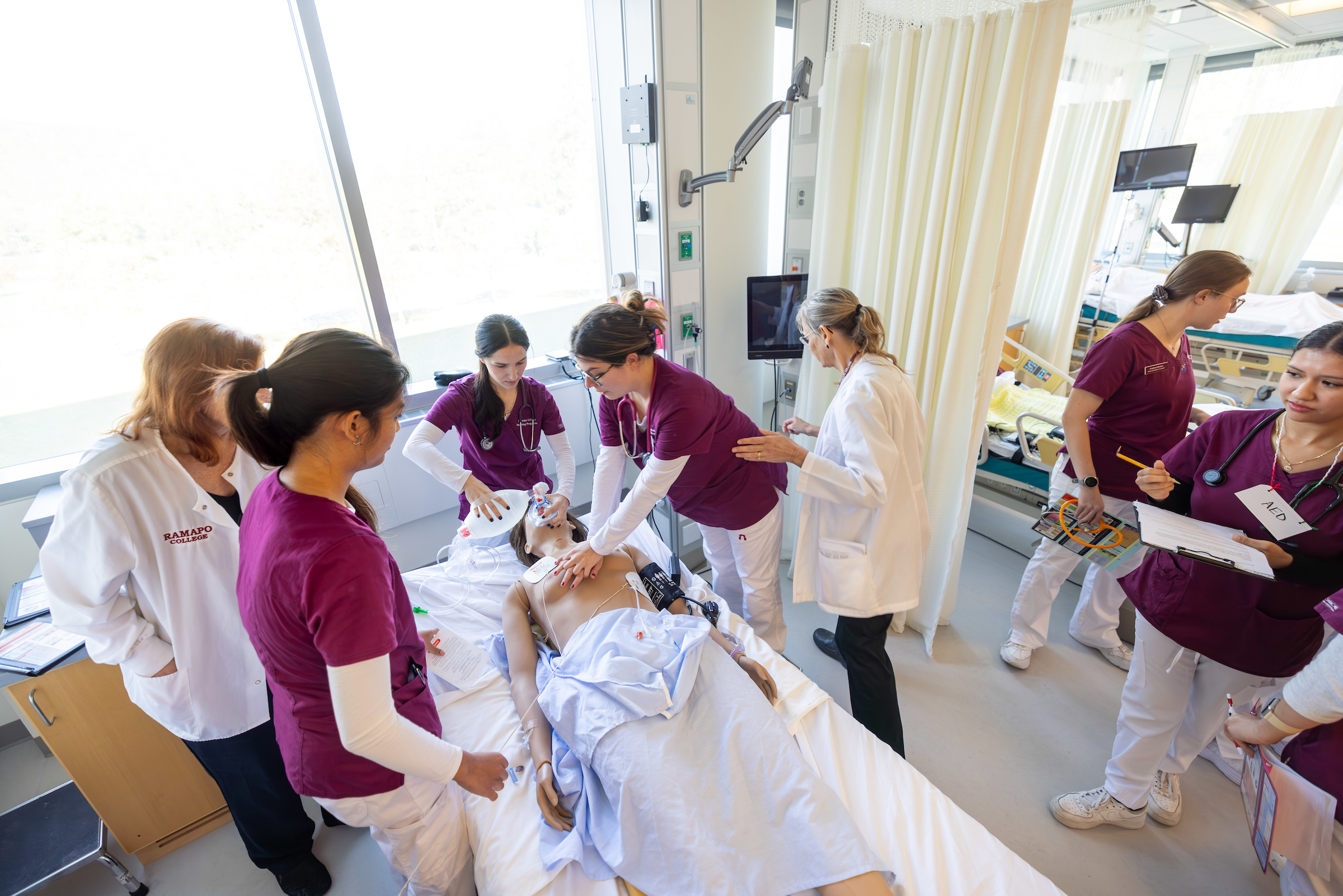 Nursing students working on patient simulation